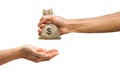 Man hand holding money bag and giving money to another person is Royalty Free Stock Photo