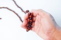 Man hand holding a muslim rosery beads, Royalty Free Stock Photo