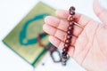 Man hand holding a muslim rosery beads, Royalty Free Stock Photo