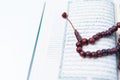 Man hand holding a muslim rosery beads, tasbih with quran asid Royalty Free Stock Photo