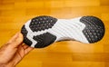 Man hand holding new Nike Running Shoe Odyssey React Shield