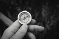 Man hand holding a old compass with broken glass. Travel concept, path selection, navigation, tourism, hiking. Autumn background. Royalty Free Stock Photo