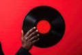 Man hand holding old vinyl retro record. Royalty Free Stock Photo