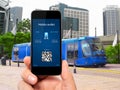 Man hand holding the phone with a mobile wallet and train ticket