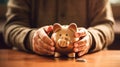 Man hand holding piggy bank, saving money wealth and financial concept. Business, finance and investment planning Royalty Free Stock Photo