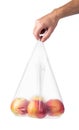 Man hand holding a plastic bag with red apples Royalty Free Stock Photo