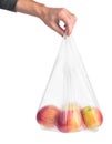 Man hand holding a plastic bag with red apples Royalty Free Stock Photo