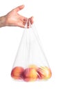 Man hand holding a plastic bag with red apples Royalty Free Stock Photo