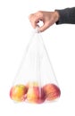 Man hand holding a plastic bag with red apples Royalty Free Stock Photo