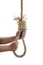 Man hand holding rope with a hangman noose knot Royalty Free Stock Photo