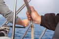 Man hand holding a sailing vessel wheel. Royalty Free Stock Photo