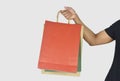 Man hand holding shopping bags on white background Royalty Free Stock Photo