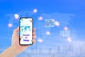 Man hand holding smartphone with Internet of things word on screen and icons connecting together Royalty Free Stock Photo