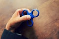 A man hand holding a hand spinner