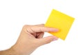 Man hand holding tellow sticky note isolated on a Royalty Free Stock Photo