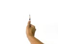 A man hand holding a very sharp pencil with his thumb in isolated white background