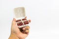 Man hand holding the white medicine box Royalty Free Stock Photo