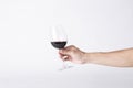 Man hand holding a wine glass on a gray background Royalty Free Stock Photo