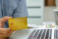 Man hand holds a credit card for online transactions or shopping online.Apply for a credit card, make a financial loan