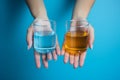 man hand holds medical bottles