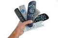 Man hand holds six remote control Royalty Free Stock Photo