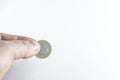 Man hand holds Turkish coins with isolated white background Royalty Free Stock Photo