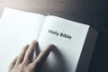 Man hand Holy Bible text Royalty Free Stock Photo