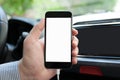 Man hand inside car holding phone with isolated screen