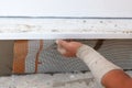 Man hand installing mesh over plastering foundation. Royalty Free Stock Photo
