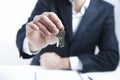 Man hand keys in office table Royalty Free Stock Photo