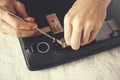 Man hand laptop disassembling Royalty Free Stock Photo