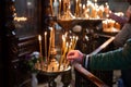 Man hand lighting candles in a church Royalty Free Stock Photo