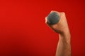 Man hand with microphone over red background Royalty Free Stock Photo