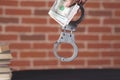 Man hand money with handcuffs Royalty Free Stock Photo