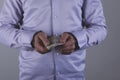 Hand money and handcuffs Royalty Free Stock Photo
