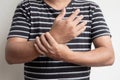 Man hand with numbness and pain in the wrist has pain and tingling in the nerve endings. which is a side effect of Guillain-Barre