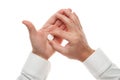 Man hand with one big white pill isolated on white background. White shirt, business style. Medicament and food supplement for Royalty Free Stock Photo