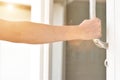 man hand open the door holding handle Royalty Free Stock Photo