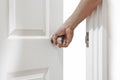 Man hand open door knob or opening white door Royalty Free Stock Photo