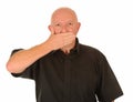 Man with hand over mouth