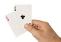 Man hand with pair of aces isolated over white Royalty Free Stock Photo