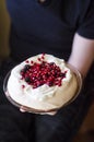 Man hand and Pavlova cake Royalty Free Stock Photo