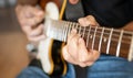 Man hand playing on electric guitar Royalty Free Stock Photo