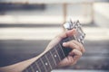 Man hand playing guitar close up hand playing c chords Royalty Free Stock Photo