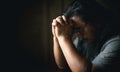 Man hand in prayer, expressing his religious faith in God through worship of Jesus Christ. Person man, turned to God in prayer, Royalty Free Stock Photo