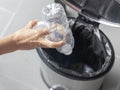 Man hand putting bottle of a plastic reuse for recycling concept environmental protection world recycle Royalty Free Stock Photo