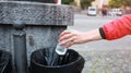 Man hand putting bottle of a plastic reuse for recycling concept environmental protection world recycle Royalty Free Stock Photo