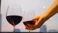 Man Hand Putting the Glass of Red Wine on Table After Drinking, Openspace Bar