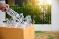 Man hand putting plastic reuse for recycling concept environmental protection world recycle Royalty Free Stock Photo