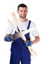 Man with hand saw and laths Royalty Free Stock Photo
